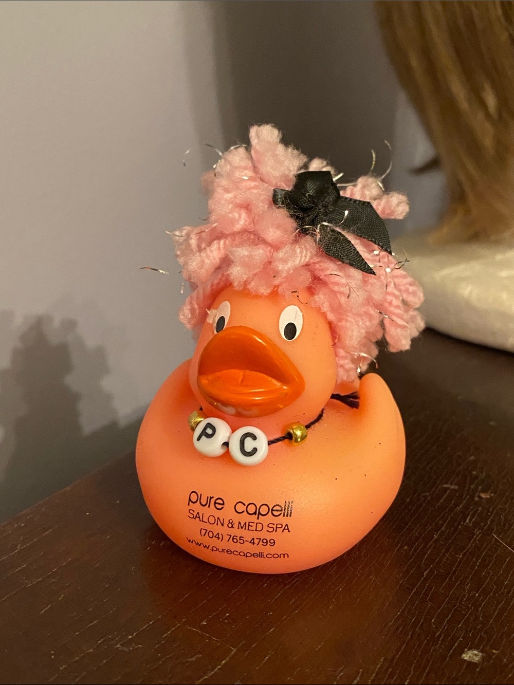 The duck branded for Pure Capelli Salon & Med Spa